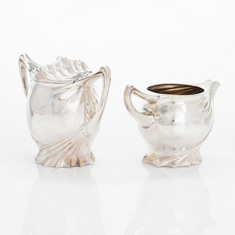 Paul Follot, a four-piece Art Nouveau silver-plated tea set, France early 20th century.