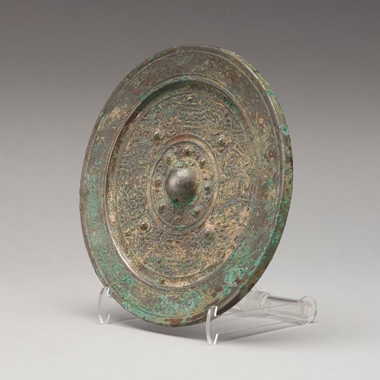 A bronze mirror, Han dynasty (206 B.C - 220 A.D).