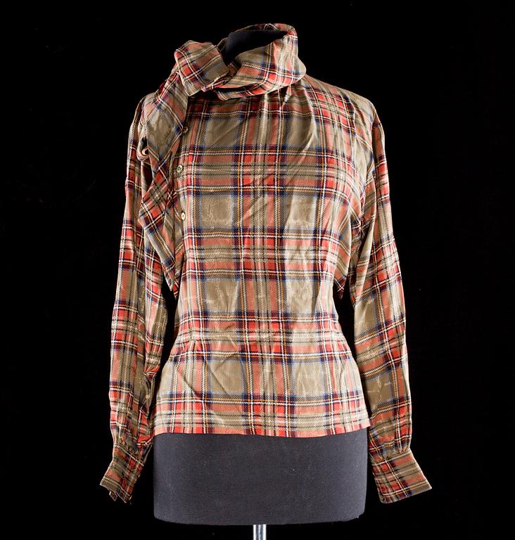 A silk blouse by Yves Saint Laurent.
