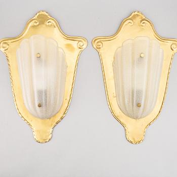 A pair of brass and glass wall lamps, 1940s.