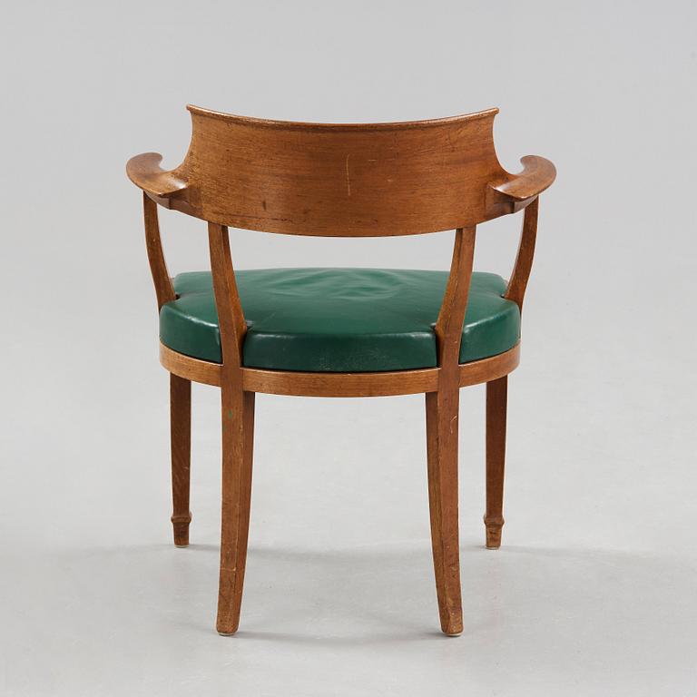 Alfred Grenander, a mahogany and green leather armchair, ca 1905.