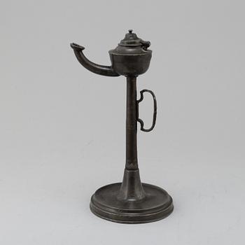 An 18th century pewter oil lamp.