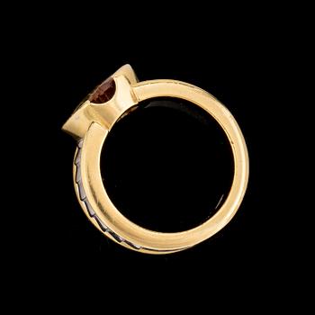An 'On track' ring by Jan Jörgensen for Georg Jensen set with a fantasy cut citrine, ca 1980's.