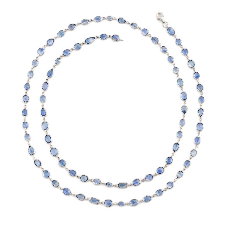 An 18K white gold necklace set  with faceted sapphires.