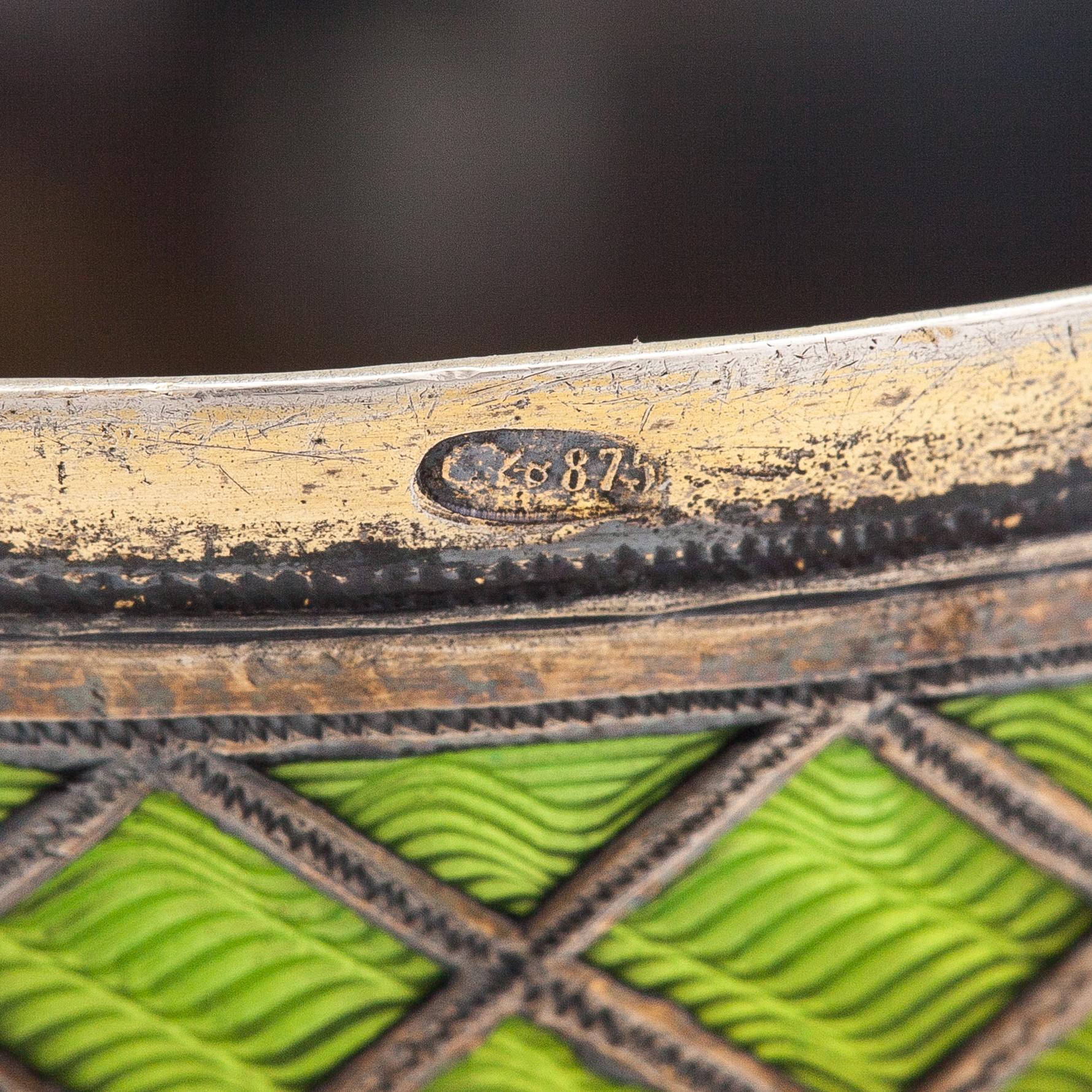 A pair of bud vases in parcel-gilt silver and guilloche enamel, early 20th century.