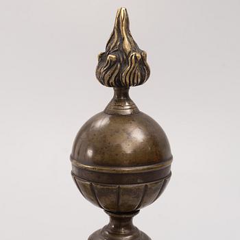 A pair of brass andirons, first half of the 20th century.