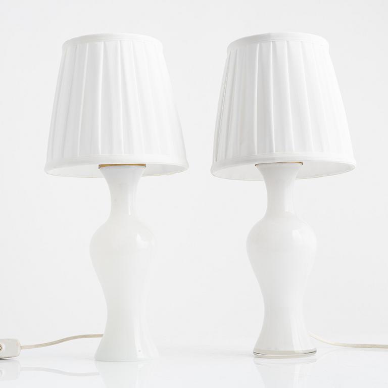 A pair of similar glass table lights from Lindshammars glasbruk, probably designed by Gunnar Ander.