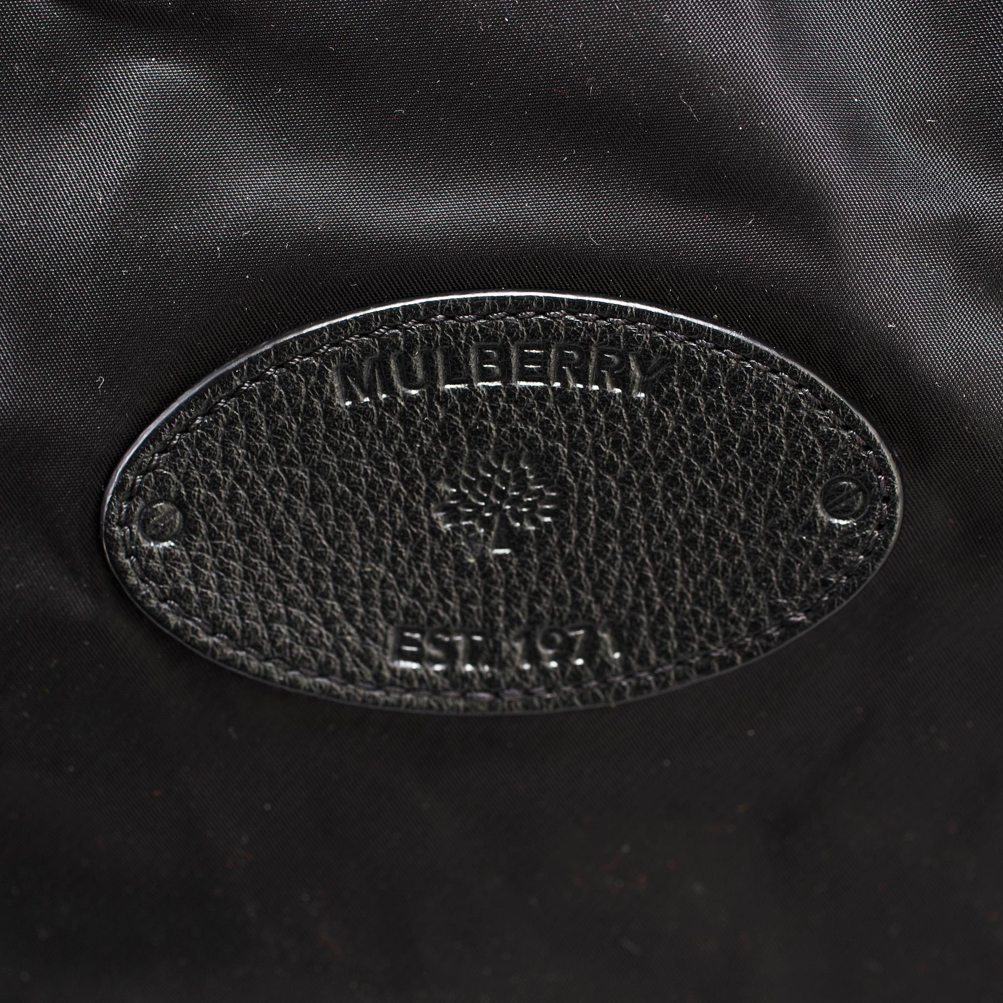 A foldable Mulberry weekend bag.