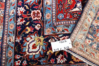 A semi.antique Kashan, c. 319 x 212 cm.