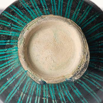 A Kashan Silhouette ware turquoise glazed pottery jug, central Iran, circa 1200.