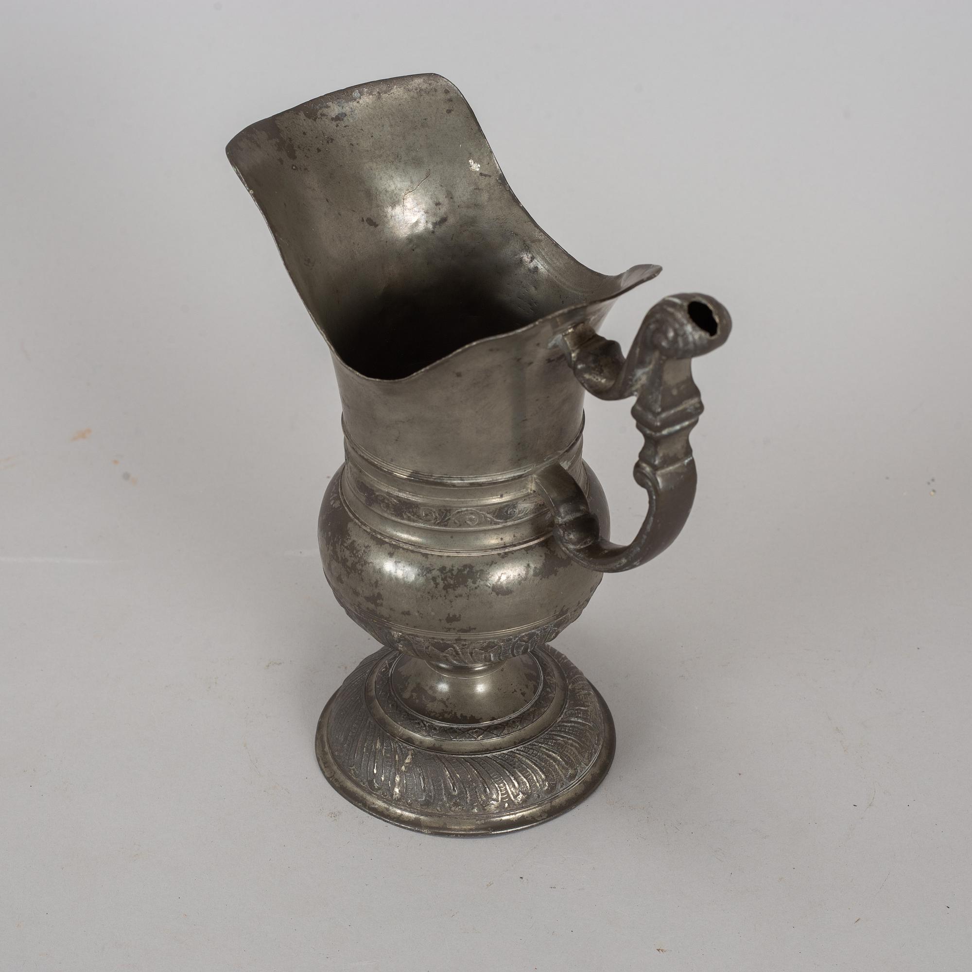 A pewter jug, probably 17th century.