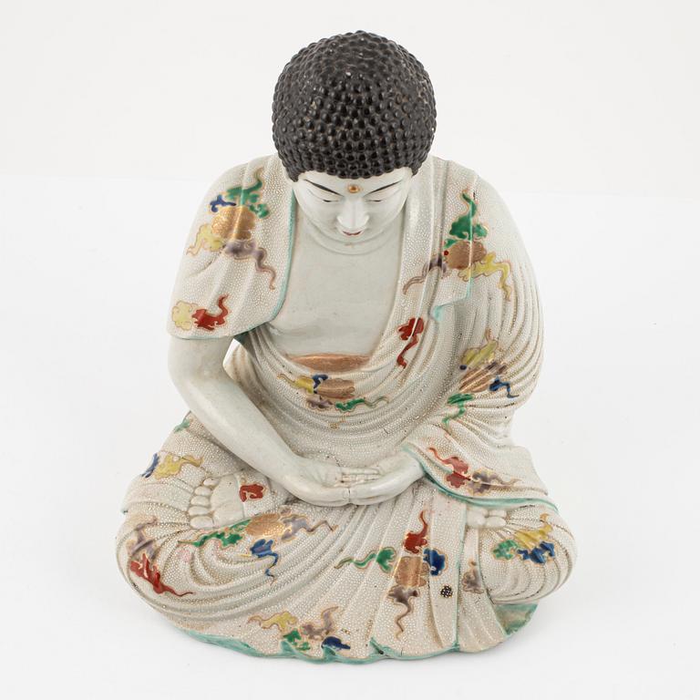 A porcelain buddha, Japan, 20th century.