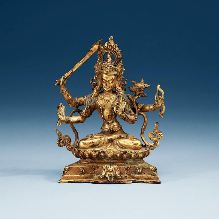 A Tibetan gilt bronze figure of a seated Bodhisattva, Qing dynasty, 18/19th Century.