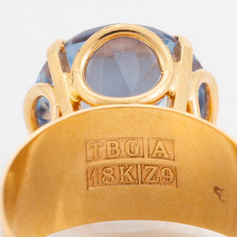 18K gold and synthetic blue spinel ring.
