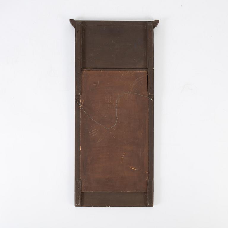 An Empire style mirror, first half of the 20th century.