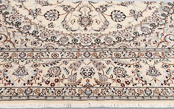 A Nain part-silk carpet, 395 x 293 cm.