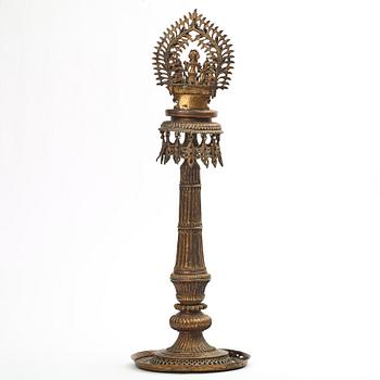A copper alloy temple lamp, Nepal, circa 1900.