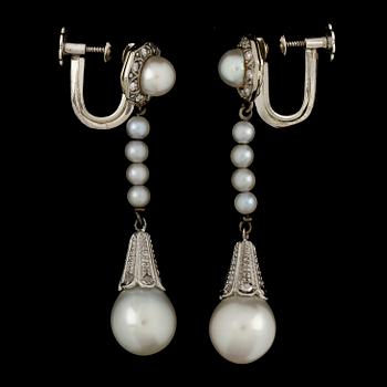 A pair of cultured pearl and diamond earrings, 1941.