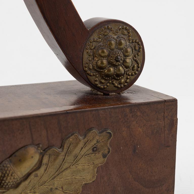An Empire mantle clock from the 19th century.