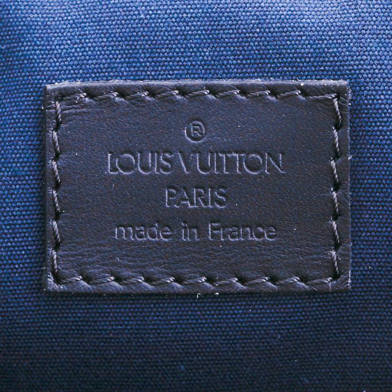 LOUIS VUITTON, a blue monogramed textile diaper bag, "Mini Lin Sac a Langer".