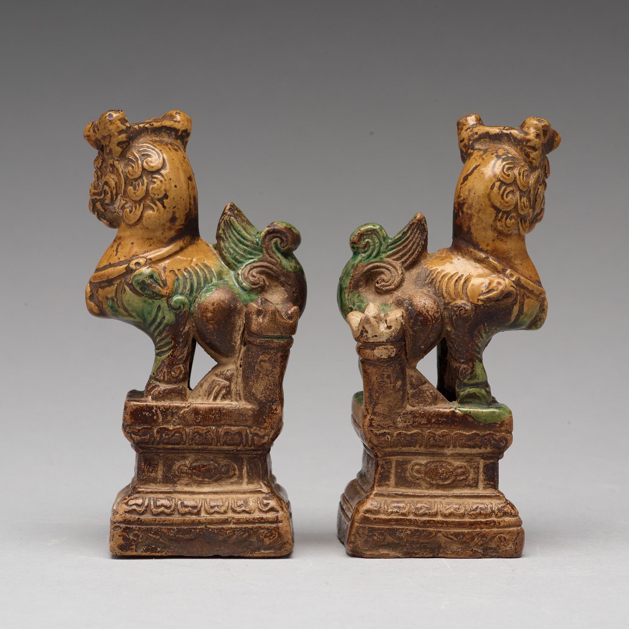A pair of green and yellow glazed joss stick holders, Ming dynasty (1368-1644).