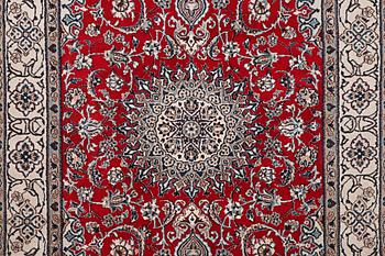 A Nain carpet, part silk, c. 303 x 198 cm.