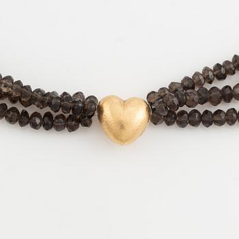 Ole Lynggaard,  smoky quartz necklace, clasp gold heart.