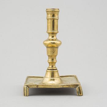 A 17th century bronze candlestick.