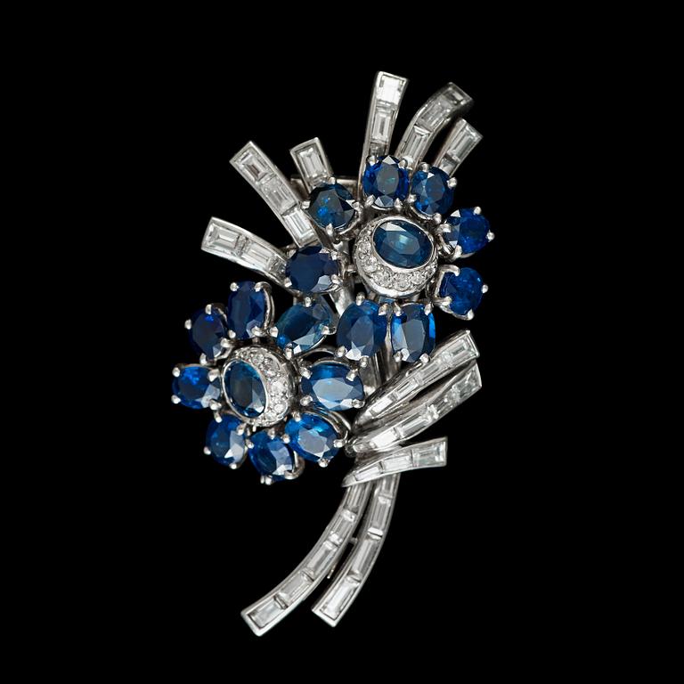 A sapphire and diamond brooch, circa 1950. Can also be worn as a pendant.