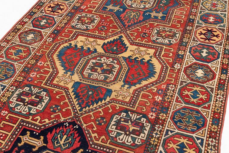 An antique Konya long rug, c. 324 x 144 cm.