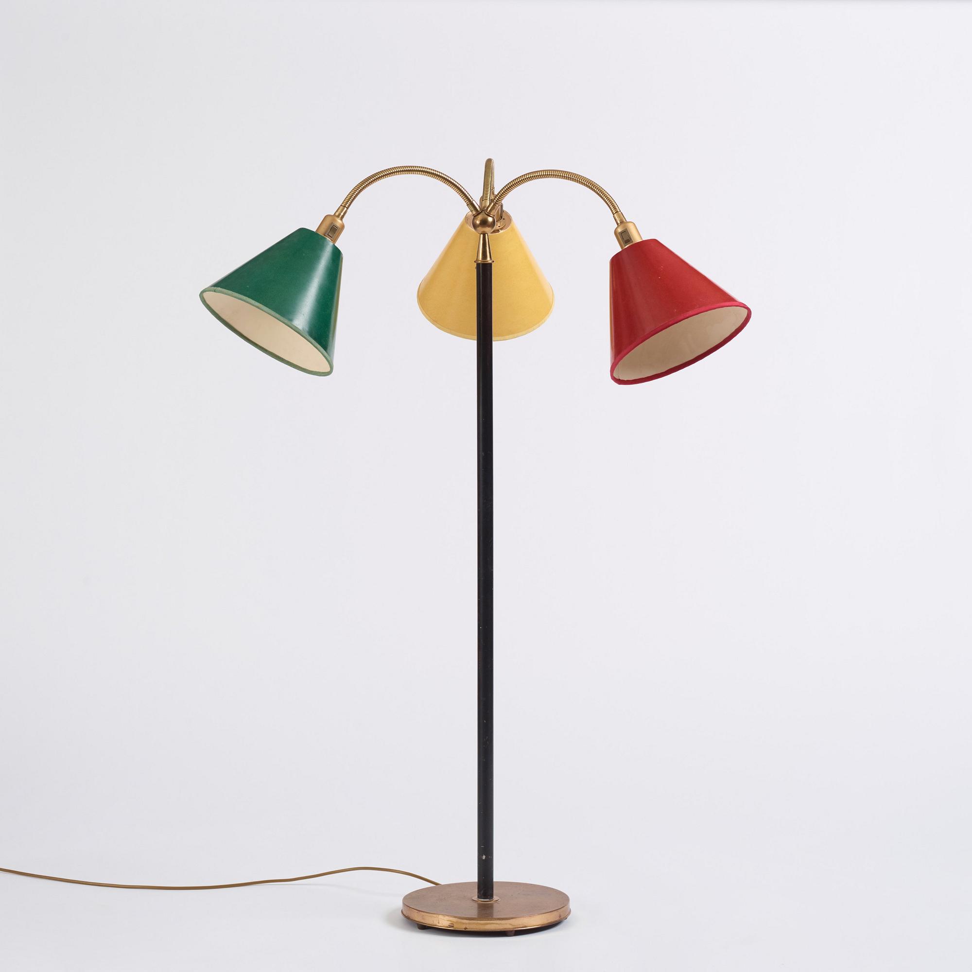 Josef Frank, a brass and black lacquered floor lamp model "2431", Firma Svenskt Tenn, Sweden.