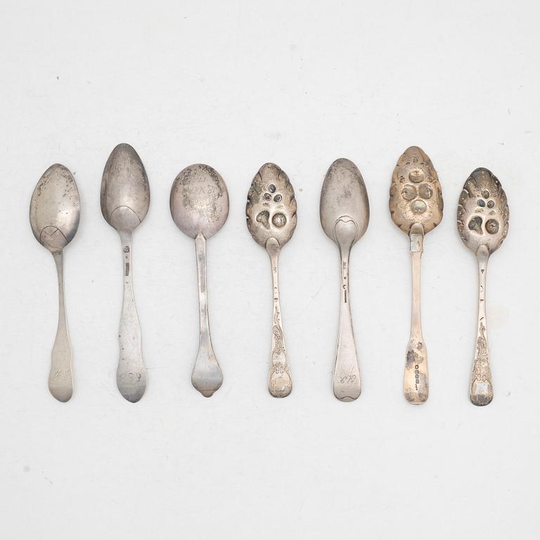 Seven silver spoons, including English and Swedish hallmarks.
