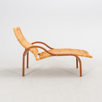 Karin Mobring & Thomas Jelinek, a "Stockholm" rattan easy chair for IKEA 1985-90.