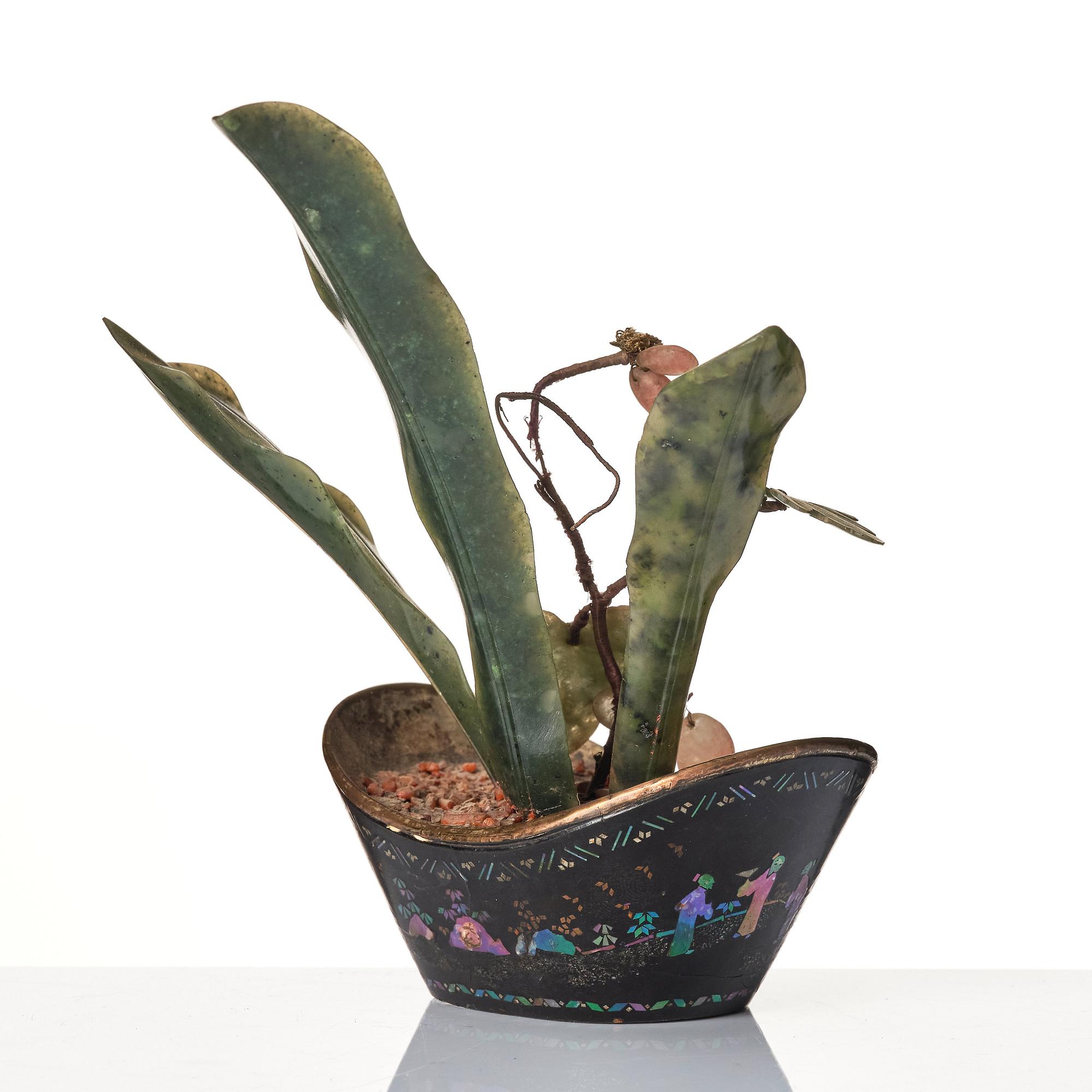 A Chinese miniature 'hard stone' flower arrangement in a ingot shaped lac burgauté pot, Qing dynasty, 18th century.