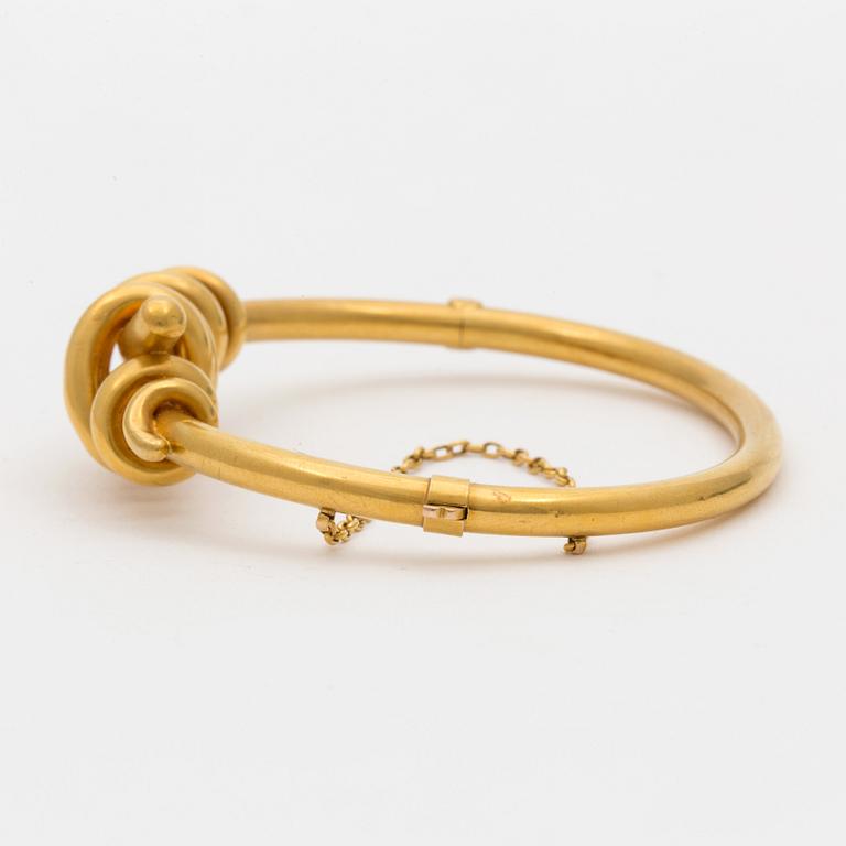 A 14K gold bracelet.