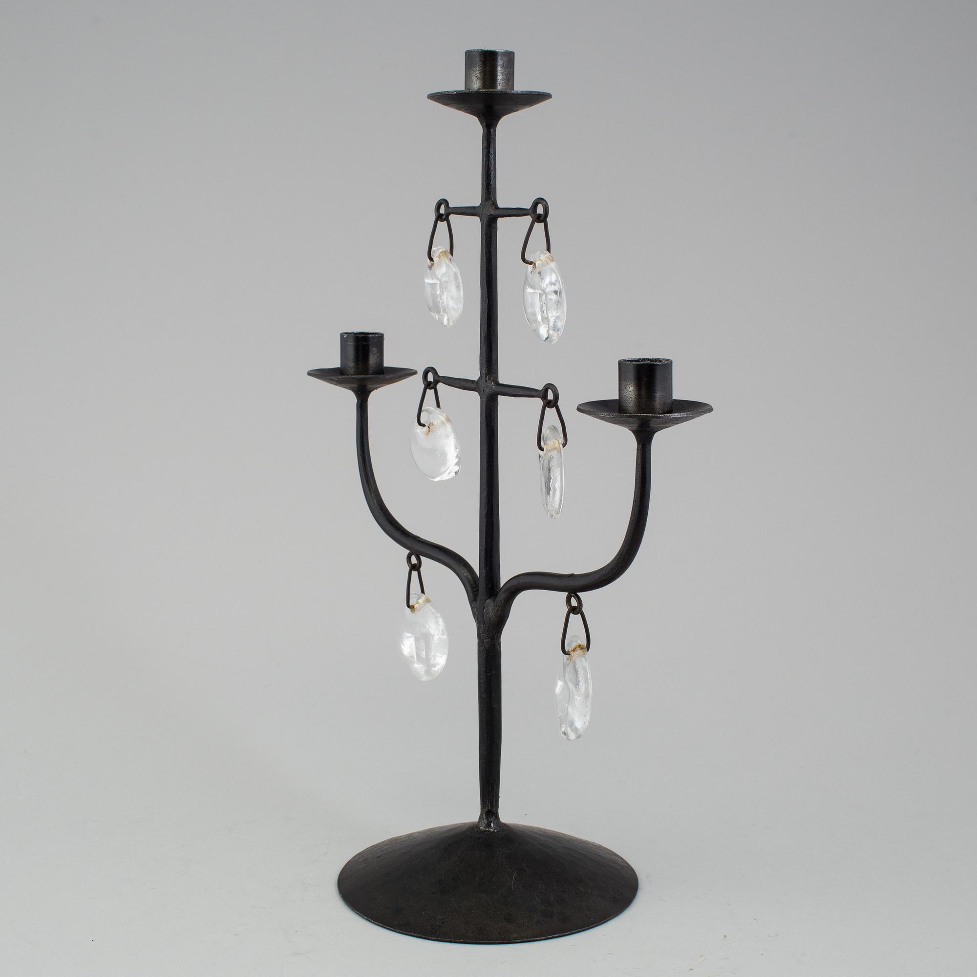 A wrought iron and glass candelabra by Erik Höglund.