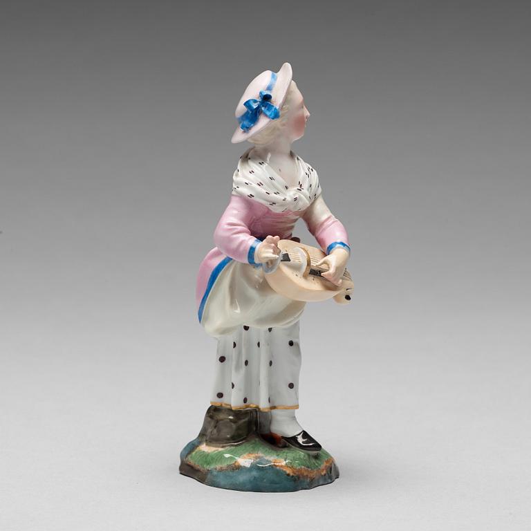 A porcelainfigure of a female musician, "Höchst mark", circa 1900.