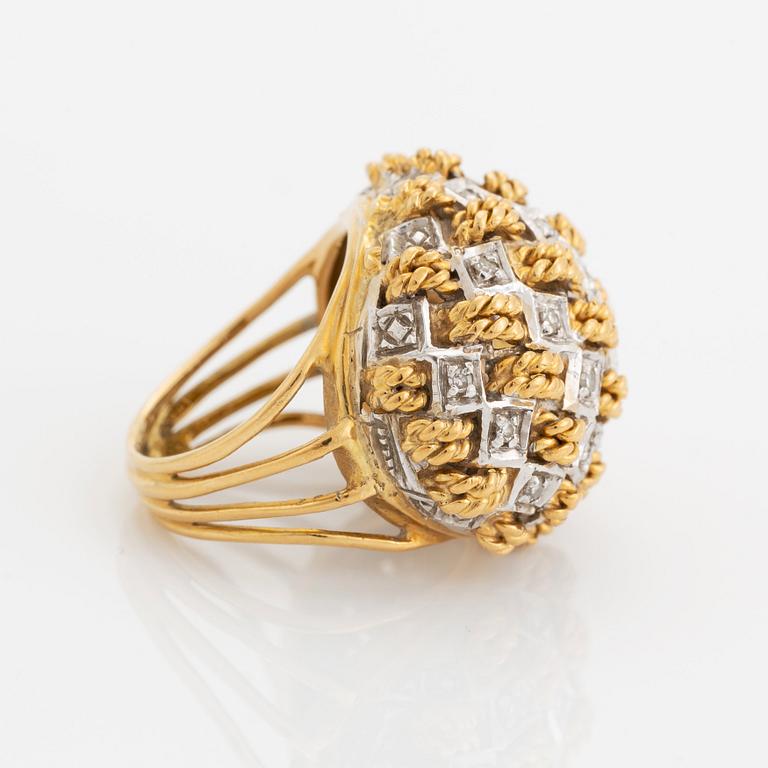 An 18K gold ring set with eight-cut diamonds.