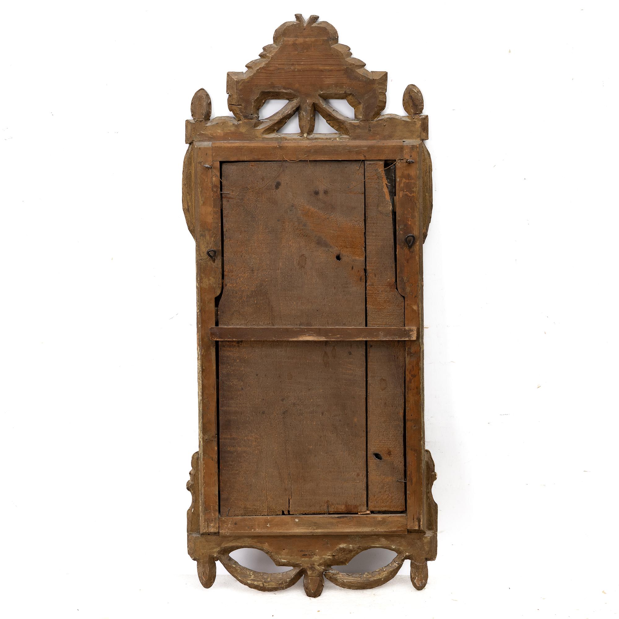 A Gustavian giltwood mirror, Stockholm, late 18th century.