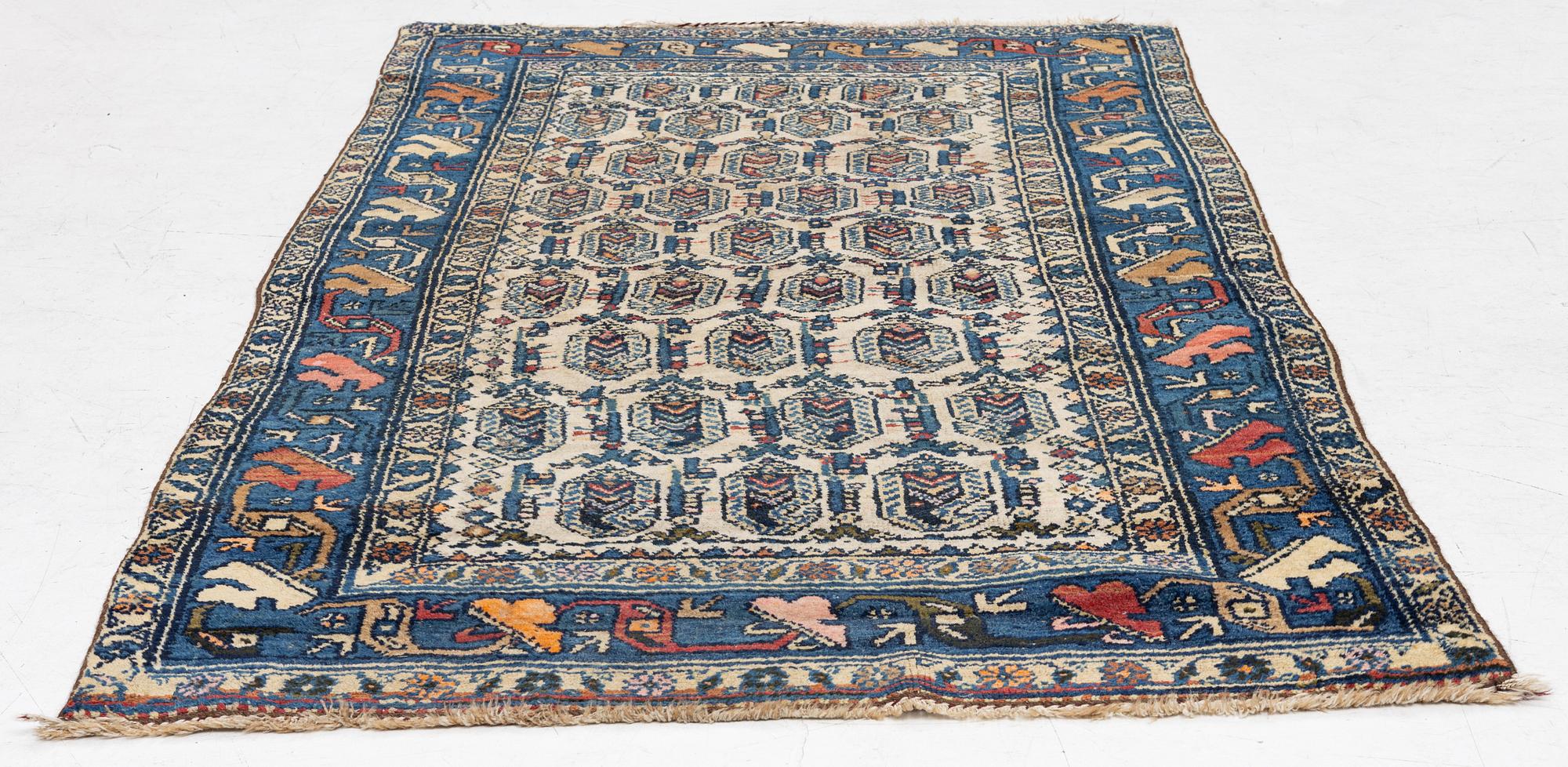 An antique Hamadan rug, c. 188 x 114 cm.