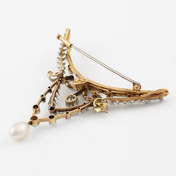 Brooch, gold and platinum, in the form of a bow and garlands with diamonds and a pearl.