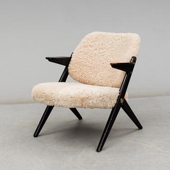 A 1950's 'Triva' easy chair by Bengt Ruda, from Nordiska Kompaniet.
