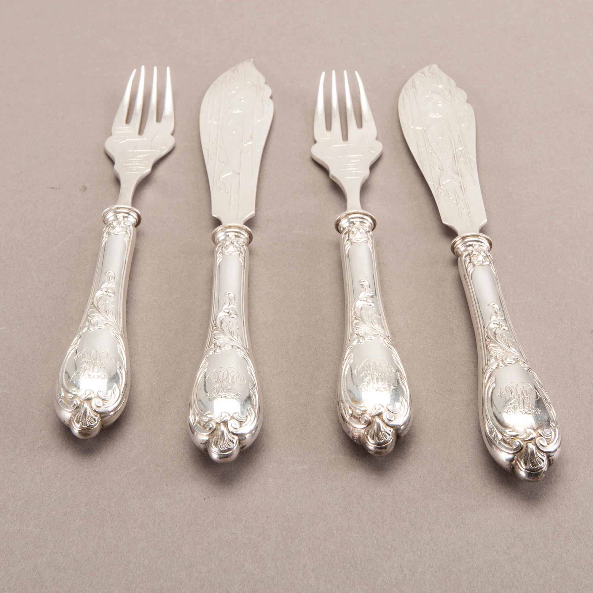 A German 20th century set of 12 fish cutlery low grade silver mark of F W Hespe hamburg early 1900s.