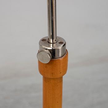 A 1940s birch wood floor lamp.