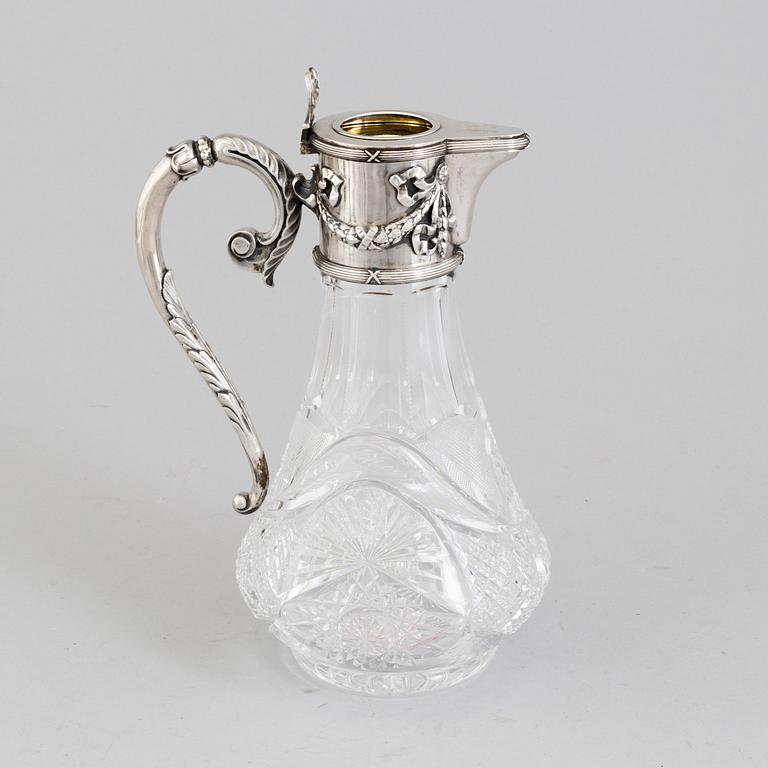 A Russian caraffe with silver mounts marked i cyrillic V Gordon, Early 20th century.