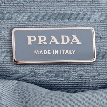 PRADA, a blue nylon crossbody bag.