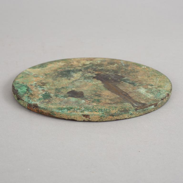 A bronze mirror, Xin-Eastern Han dynasty (9-220).