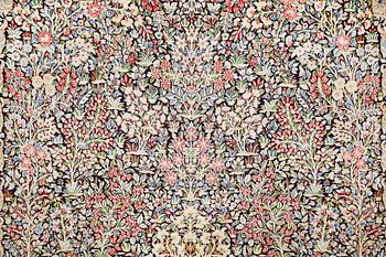 A Kirman Laver carpet, 'Millefleur', approx. 492 x 350 cm.