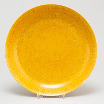 A Chinese yellow-glazed dish, 20th century.