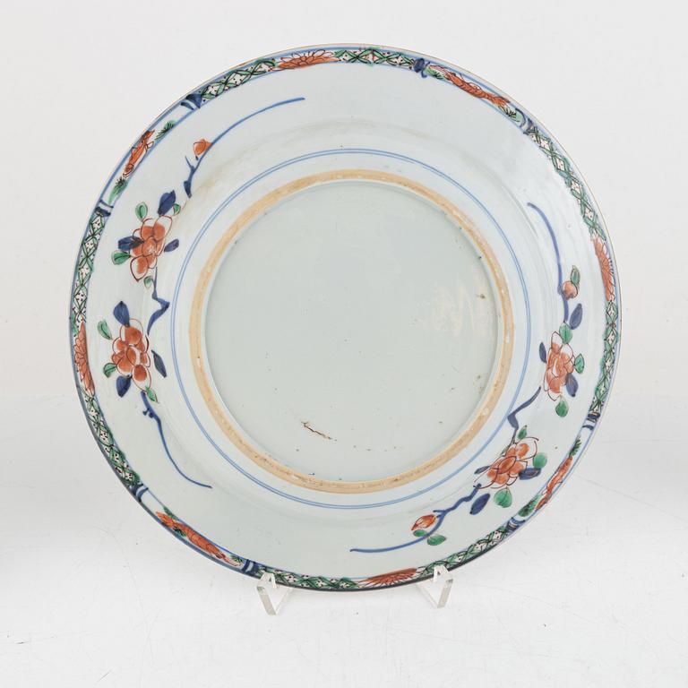 A set of three Chinese famille verte export porcelain plates, Qing dynsaty, 18th century.